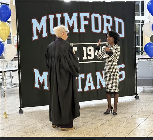 Judge Cynthia Stephens swears in new Board of Education Member Monique Bryant at Mumford High School on December 4, 2024. 